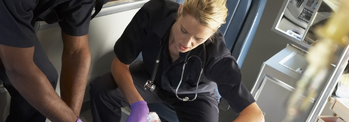 EMTs working on patient in ambulance