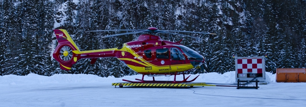 A helicopter landing in snow
