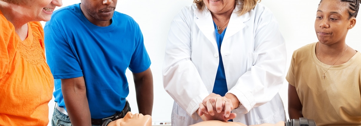 Instructor performing CPR on a mannequin
