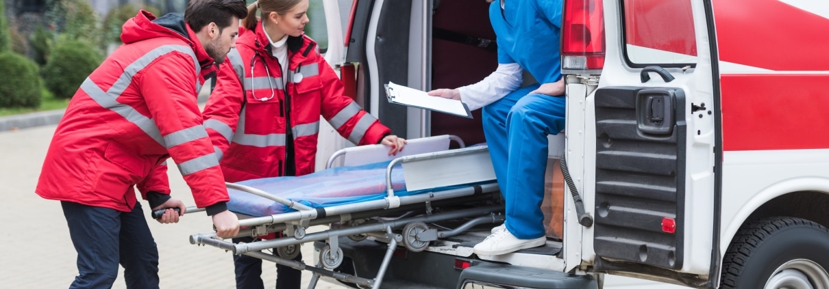 EMS professionals moving a stretcher
