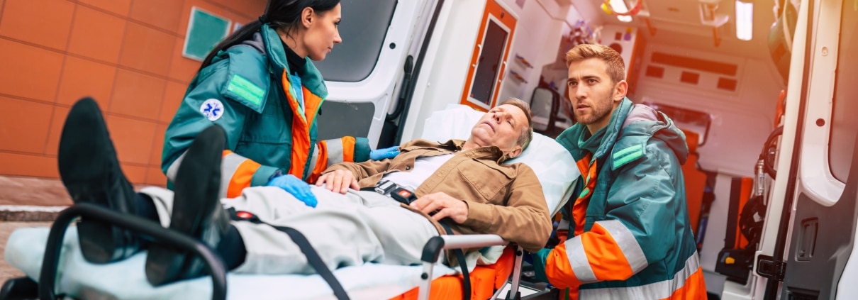 EMS professionals transporting a stretcher