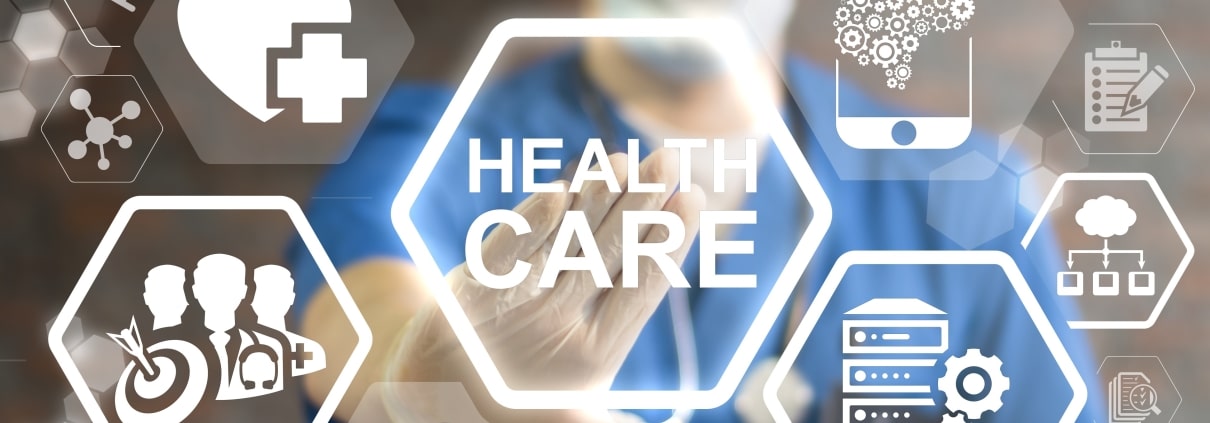 Healthcare technology logos in front of blurred healthcare worker