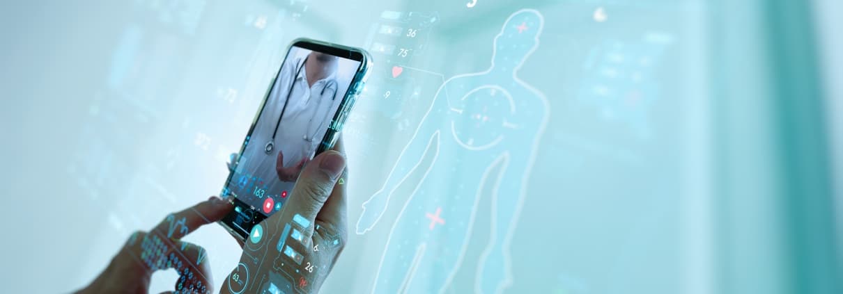Concept of telemedicine with close up of a person's hands and smartphone