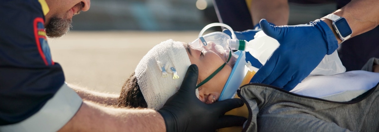 Close up of EMS professionals stabilizing a car crash victim